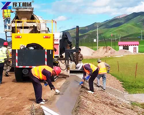 concrete curb machine is working concrete curb machine is working